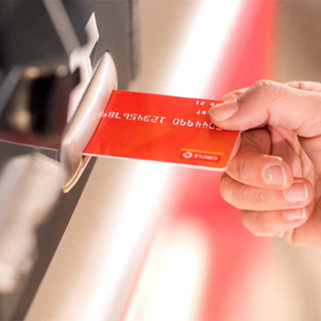 Customer inserting a fuel card into the card slot