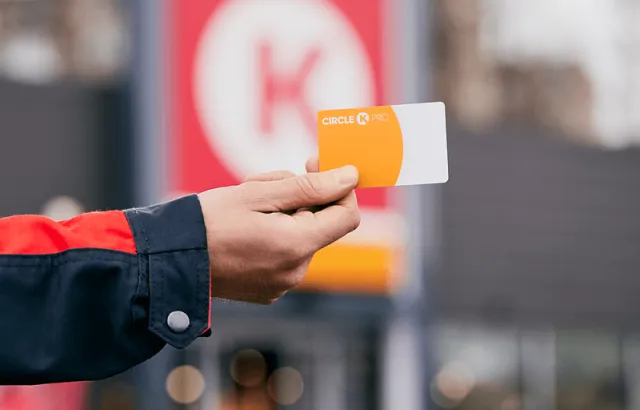 Person holding Circle K Pro card at a Circle K station